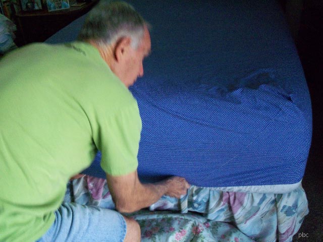 Martin making the bed